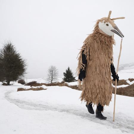 11569-1576669052-_lora_SDXL_Mask_Sa_May_1_ mask,  a person dressed in a costume walking in the snow.png